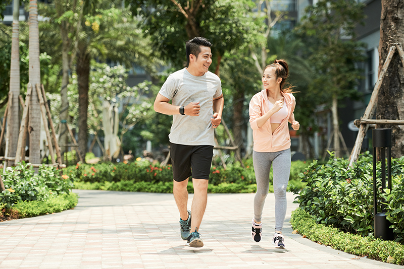 Man and woman jogging together in the park