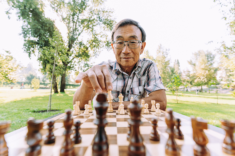 Senior man playing chess